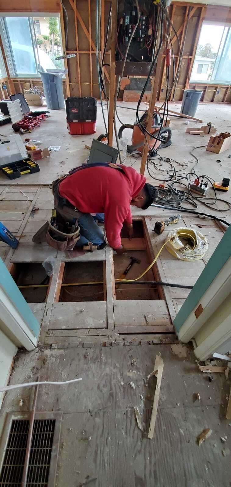 Man is repairing floor