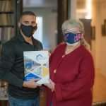People holding book